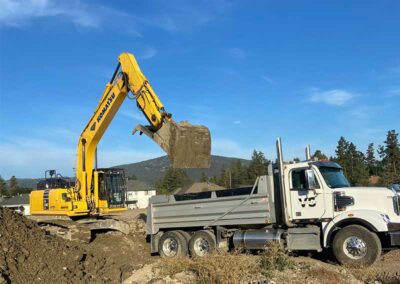 Godard-Excavating-Komatsu-yellow-digger-filling-truck