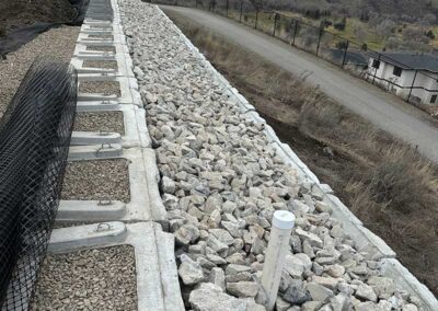 Godard-Excavating-building-retaining-wall-with-stone-fill
