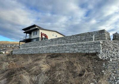 Godard-Excavating-two-level-retaining-wall-in-daylight