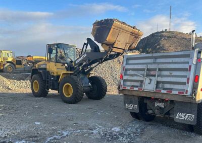 Gordon-Excavating-bulldozer-filling-dumptruck